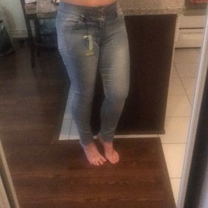 High Rise skinny jeans with button fly